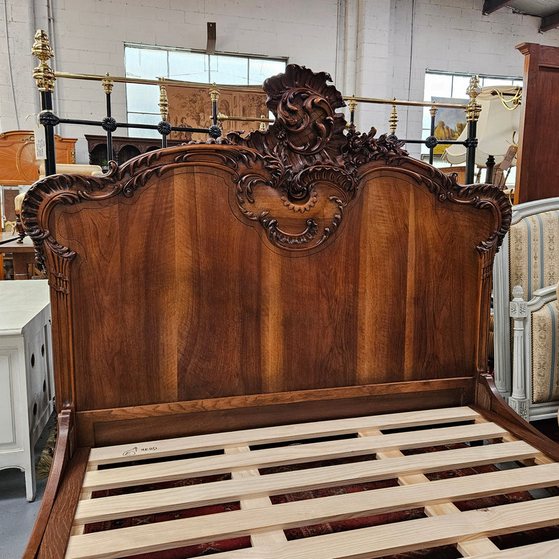 Beautifully carved Antique Louis XV style French Walnut queen size bed. Comes with custom made bed slates. Sourced from France and in good original detailed condition.