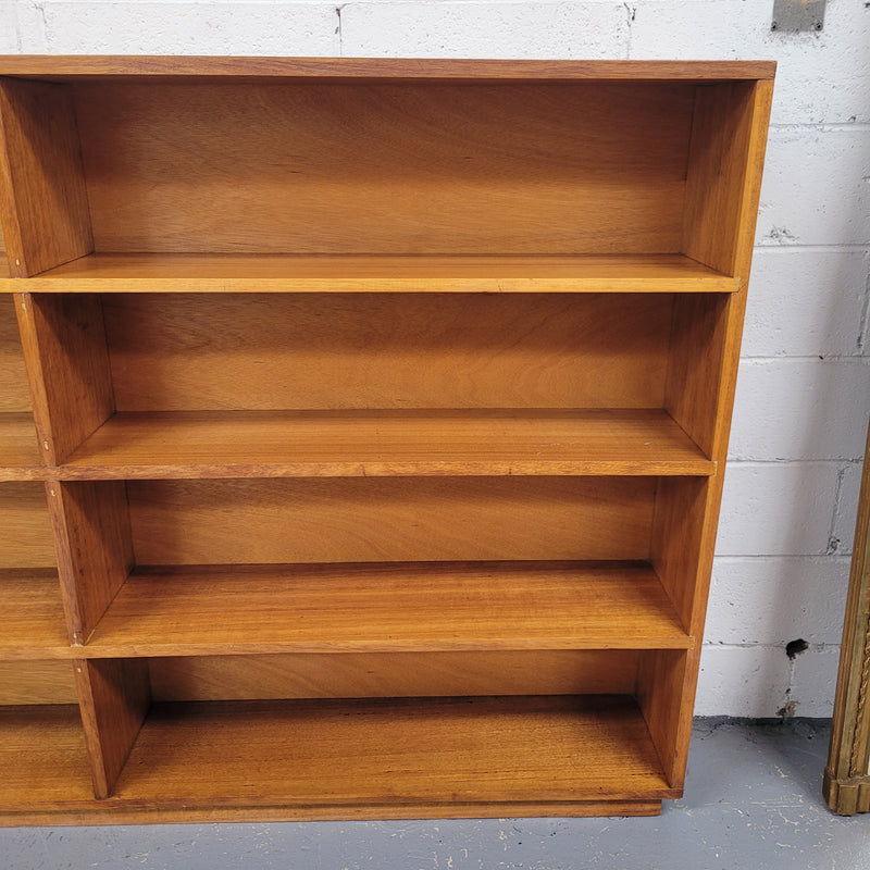 Australian Vic Ash double open bookcase with eight fixed shelves of pleasing narrow proportions. Sourced locally and in good original condition. Please view photos as they help form part of the description and condition.