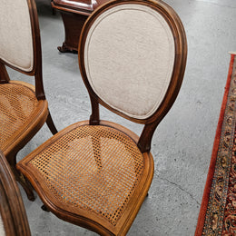 Stunning set of eight French Louis XV style walnut cane seat with upholstered back and ormolu mounts on the legs. Circa 1900. They are in excellent original condition and very comfortable. Please see photos as they form part of the description and condition.