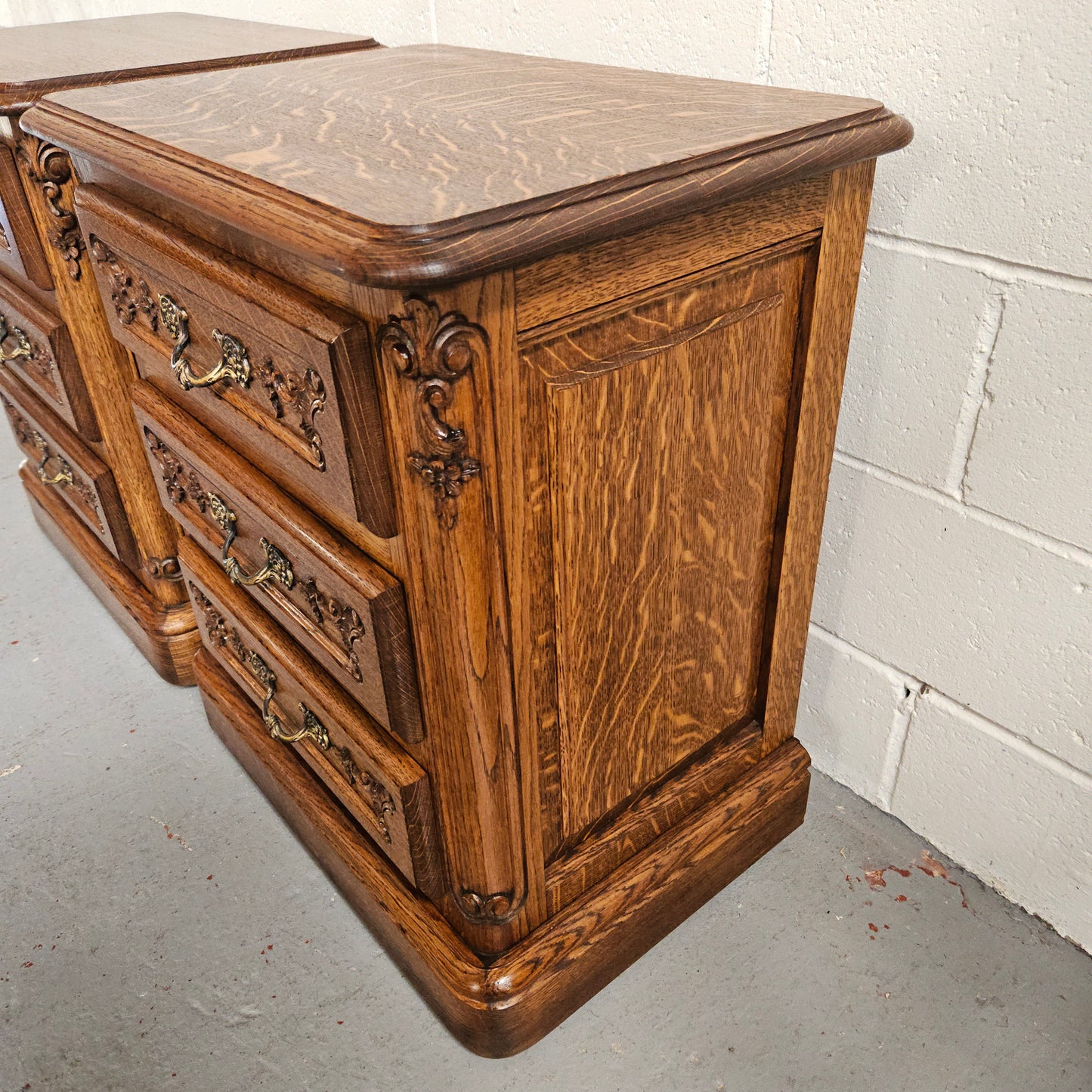 Hard to find Louis XVI style French Oak bedsides with three drawers and lovely carvings. They are in good original detailed condition. 
