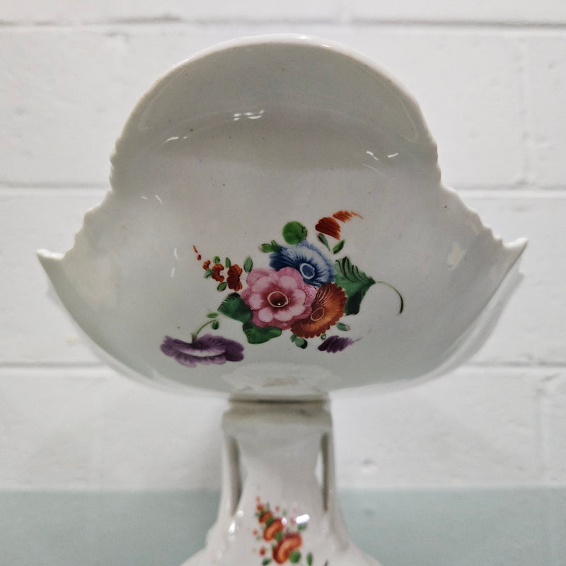 Lovely antique Coalport comport with a floral design 1830's , it is in good original condition with some faults under the bowl during the making. 