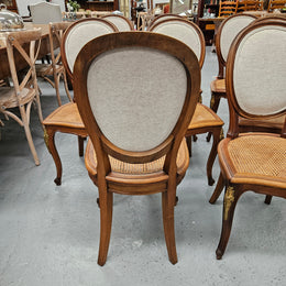 Stunning set of eight French Louis XV style walnut cane seat with upholstered back and ormolu mounts on the legs. Circa 1900. They are in excellent original condition and very comfortable. Please see photos as they form part of the description and condition.