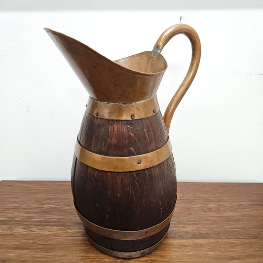 Antique miniature copper and French Oak jug. Hard to find and has been sourced directly from France. In good original detailed condition.