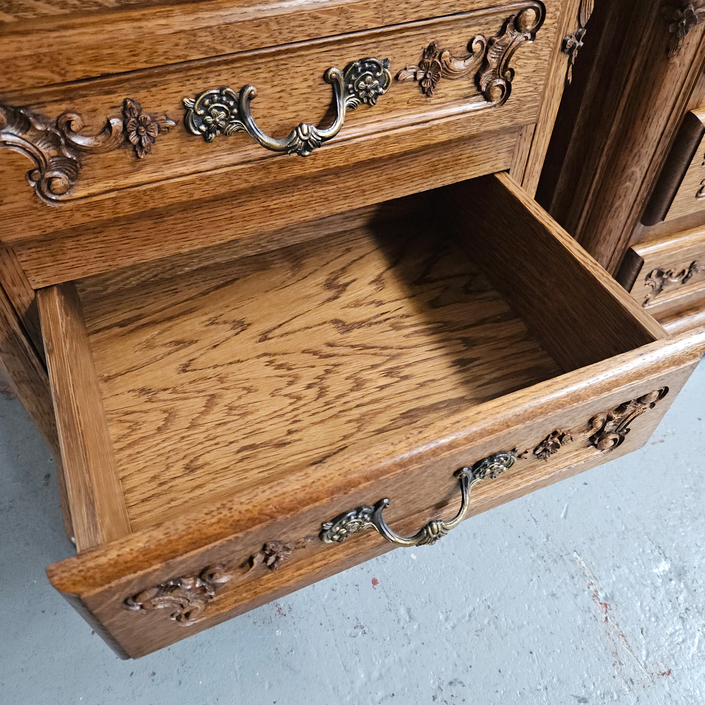 Hard to find Louis XVI style French Oak bedsides with three drawers and lovely carvings. They are in good original detailed condition. 