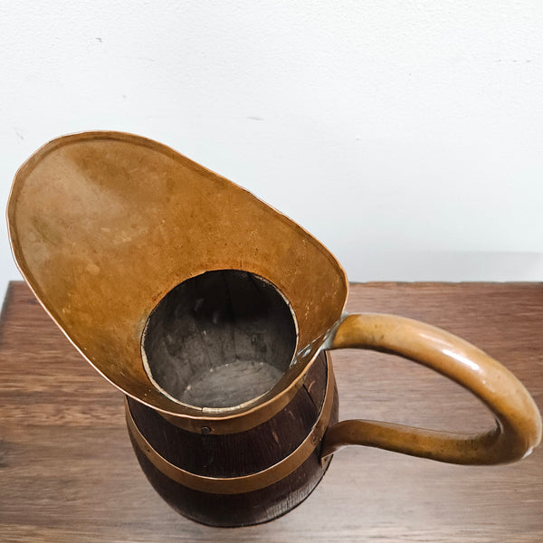Antique miniature copper and French Oak jug. Hard to find and has been sourced directly from France. In good original detailed condition.