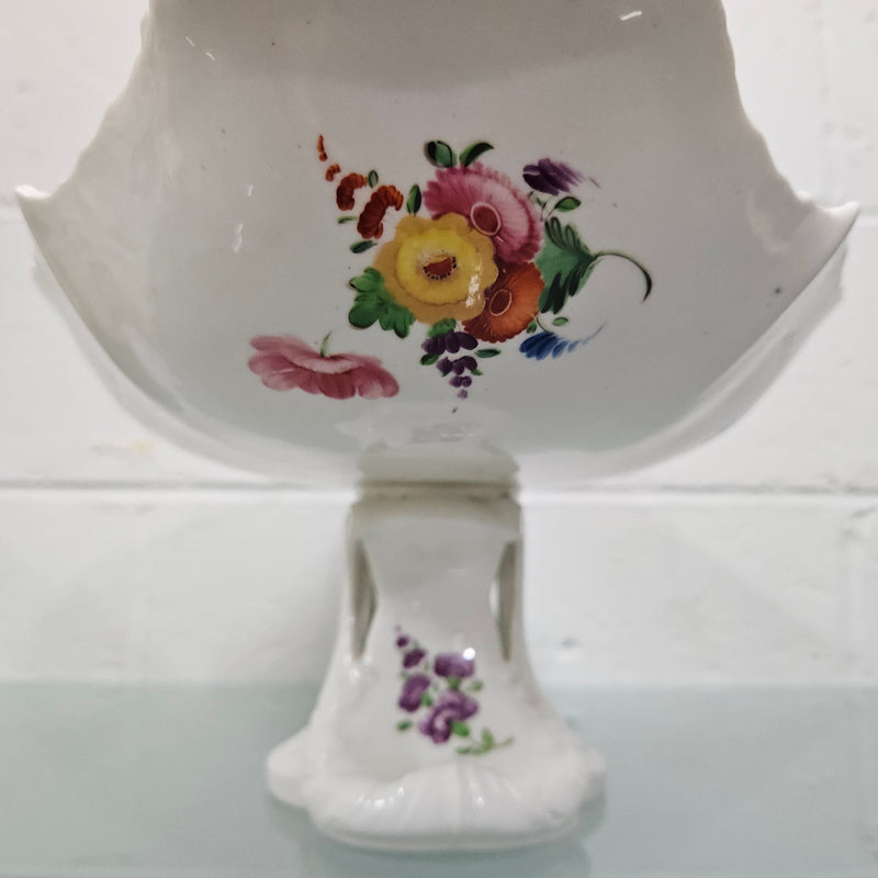 Lovely antique Coalport comport with a floral design 1830's , it is in good original condition with some faults under the bowl during the making. 