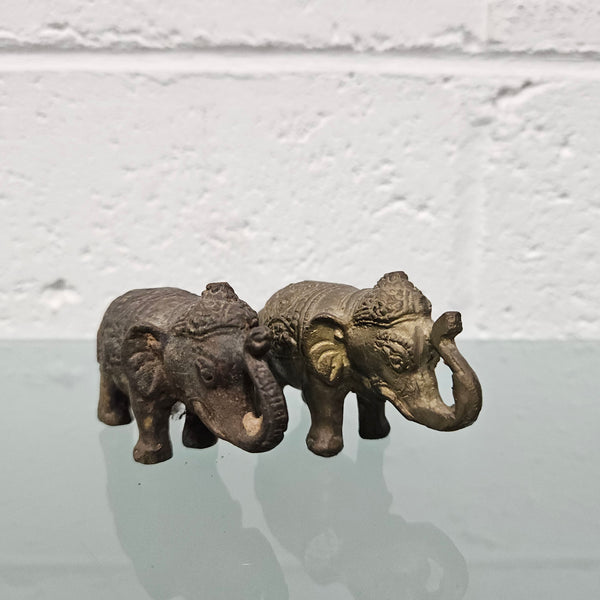 Pair of vintage aged brass elephants with raised trunks, in good original condition.