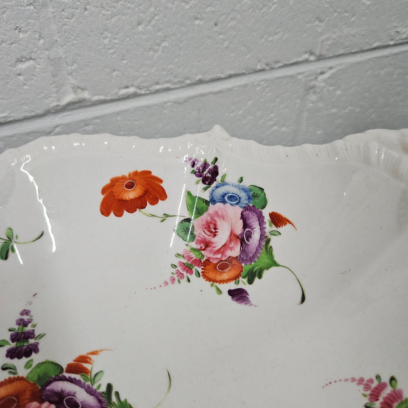 Lovely antique Coalport comport with a floral design 1830's , it is in good original condition with some faults under the bowl during the making. 