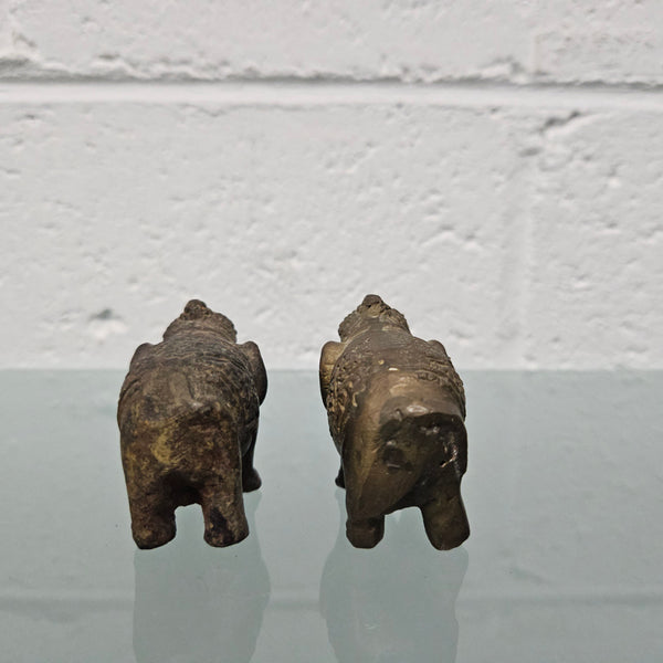 Pair of vintage aged brass elephants with raised trunks, in good original condition.