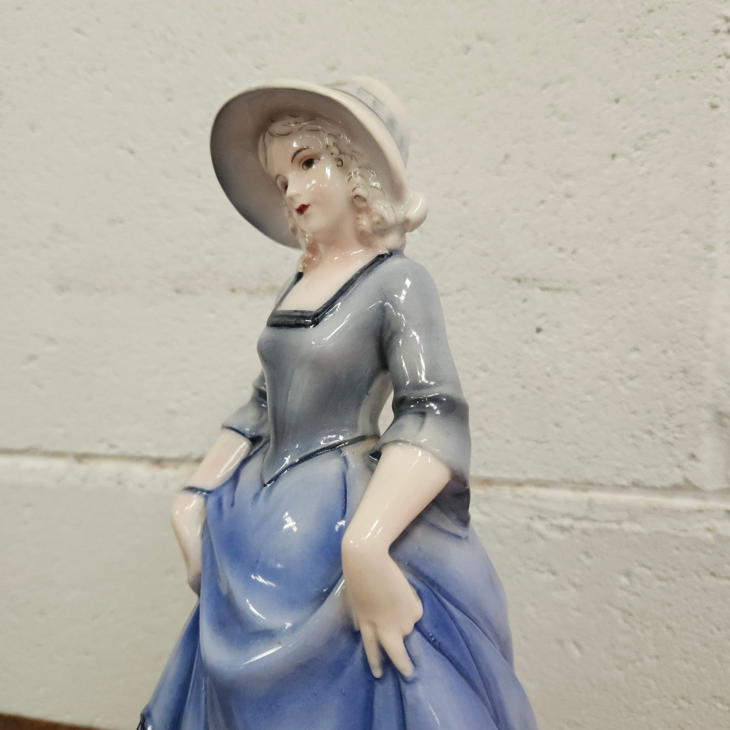 German Porcelain Figurine of a Lady in Blue Dress