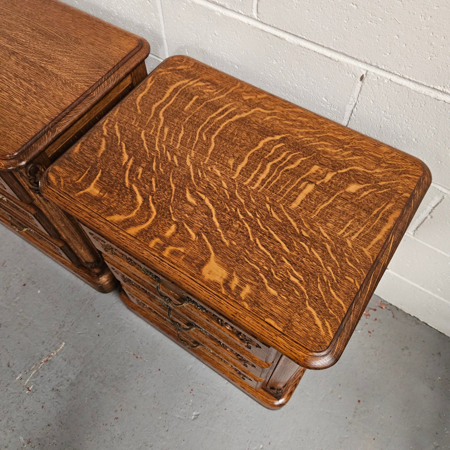 Hard to find Louis XVI style French Oak bedsides with three drawers and lovely carvings. They are in good original detailed condition. 