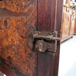 Stunning early 19th Century Elm buffet featuring two highly figured elm doors and drawers, it provides ample storage and is in good original condition.