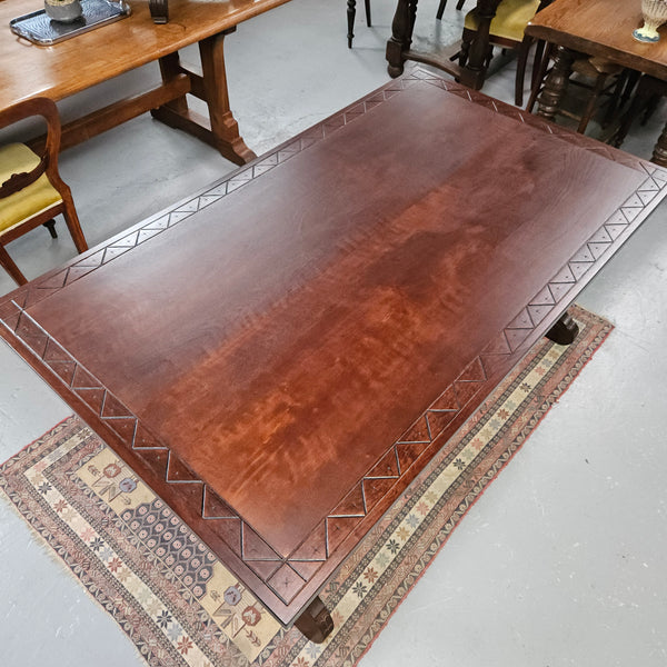 Vintage walnut Spanish style farmhouse table with a beautiful top and iron work. It is in good restored condition. Circa 1950'S.