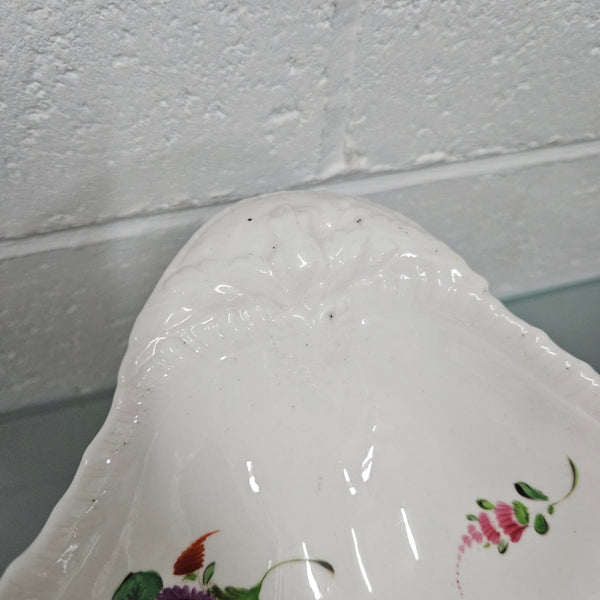 Lovely antique Coalport comport with a floral design 1830's , it is in good original condition with some faults under the bowl during the making. 