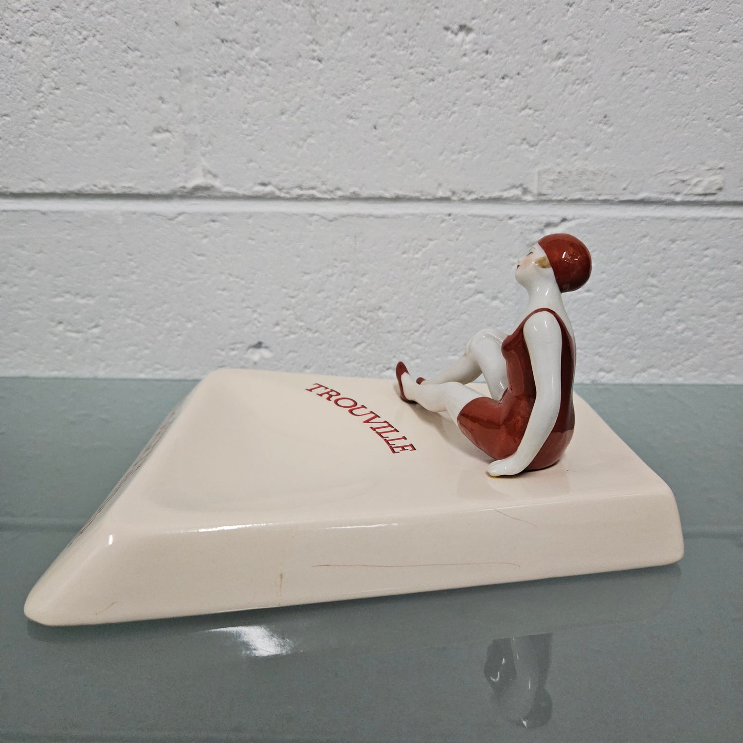 Unusual vintage female figure on large ceramic base. Souvenir Trouville De Normandie. Circa: 1950's.&nbsp; Could be used for keys, change or decoration. In good original condition.