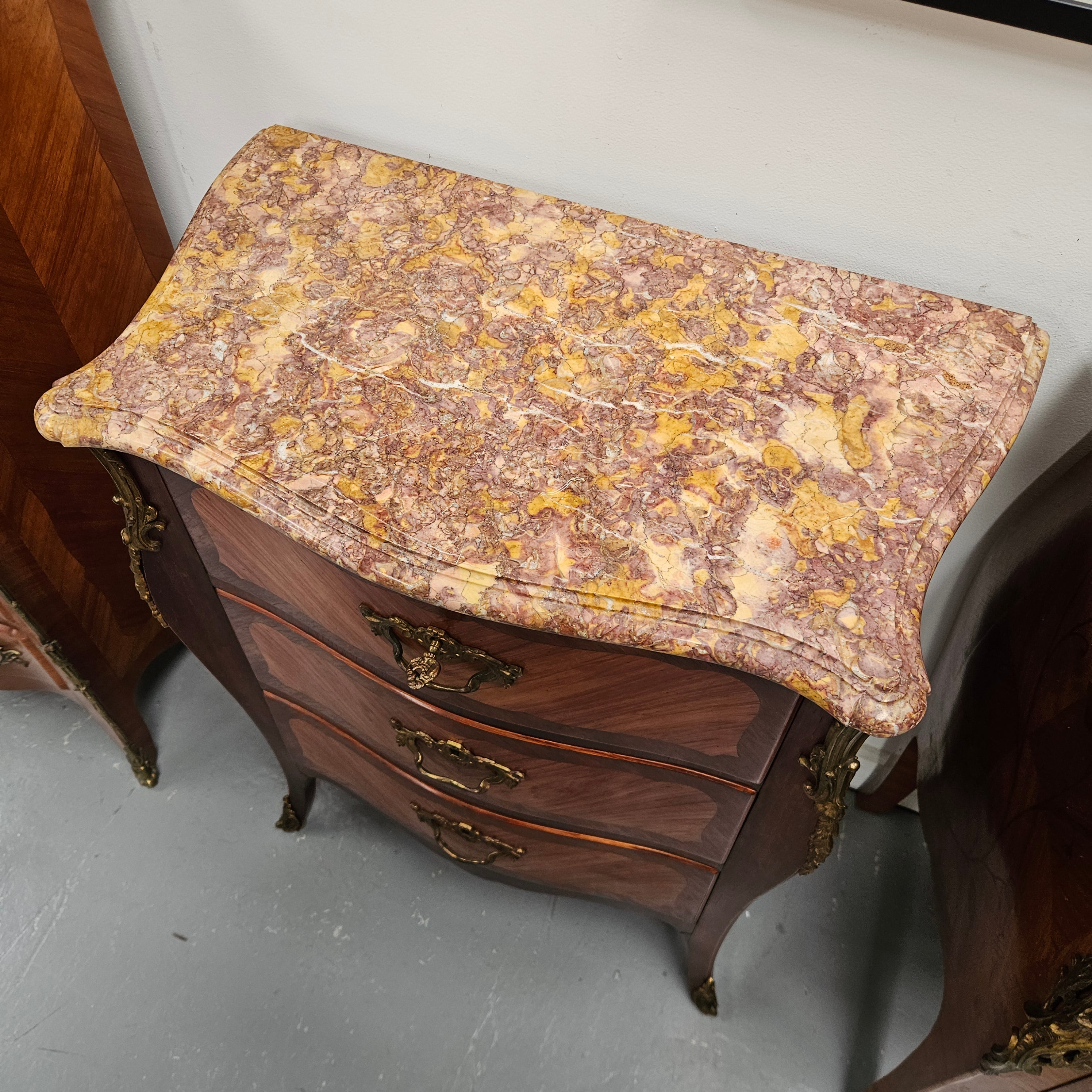 Attractive Louis XVth Style Marble Top Commode of Medium Proportions.