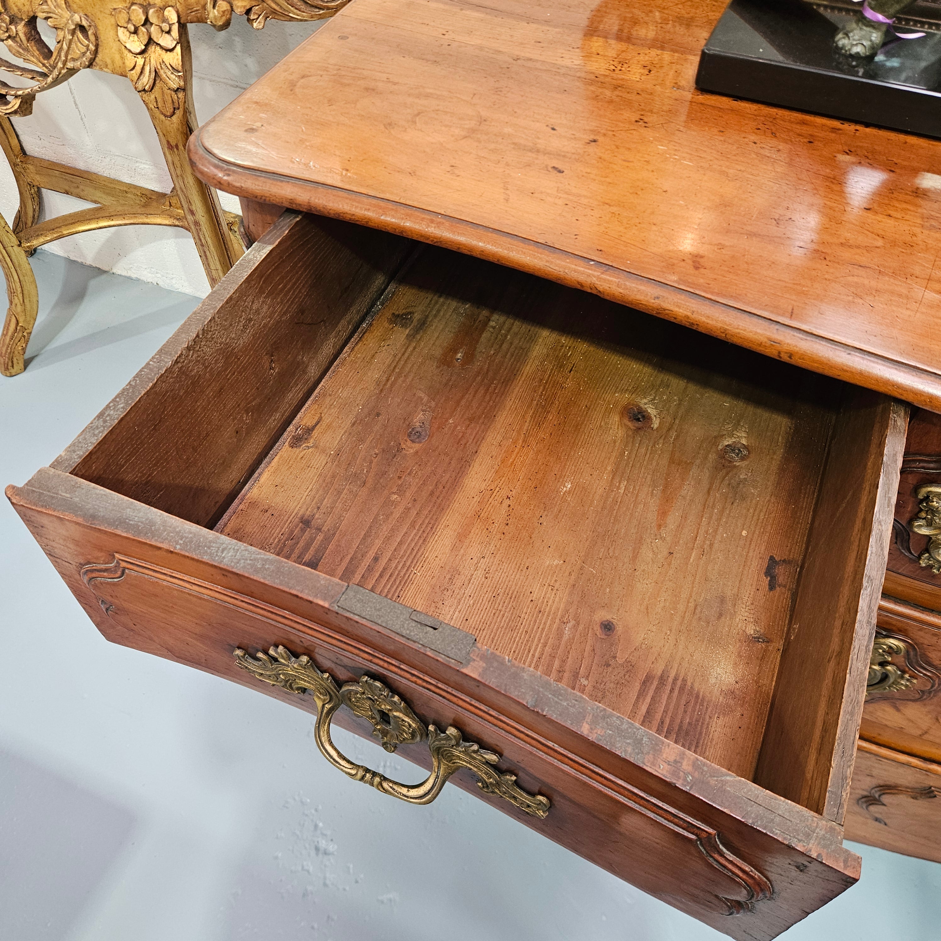 Fruitwood commode — open upper drawer and timber interior