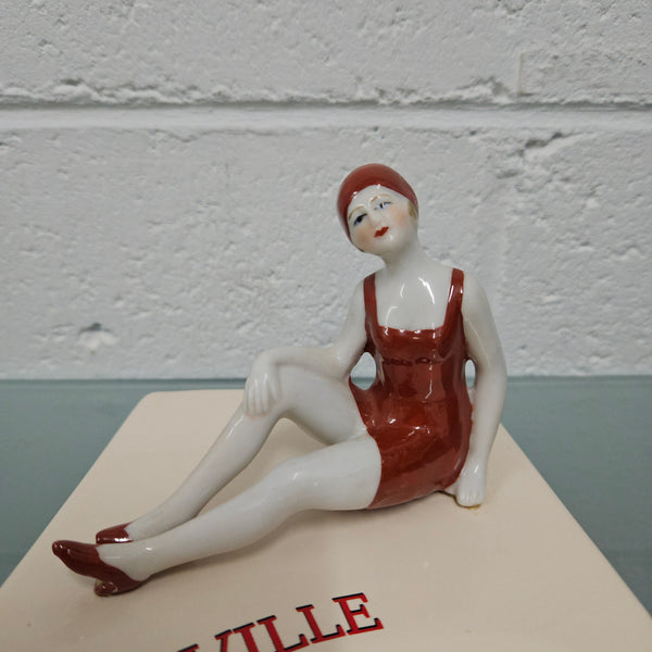 Unusual vintage female figure on large ceramic base. Souvenir Trouville De Normandie. Circa: 1950's.&nbsp; Could be used for keys, change or decoration. In good original condition.