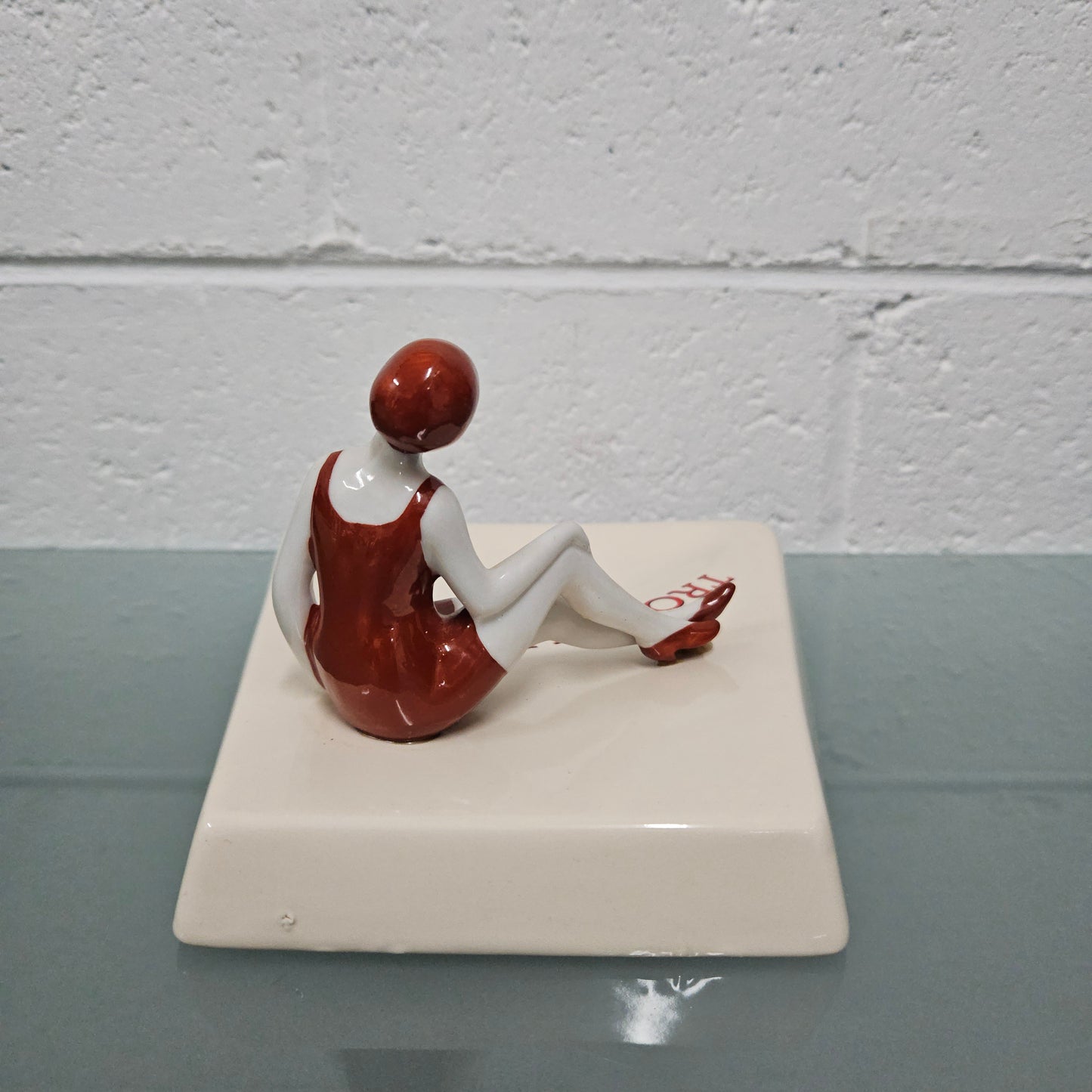 Unusual vintage female figure on large ceramic base. Souvenir Trouville De Normandie. Circa: 1950's.&nbsp; Could be used for keys, change or decoration. In good original condition.