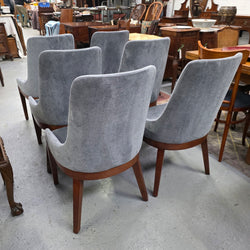 Set of six grey upholstered dining chairs, rear view