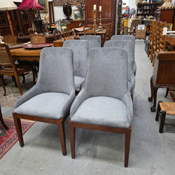 Set of six modern grey upholstered dining chairs, front view