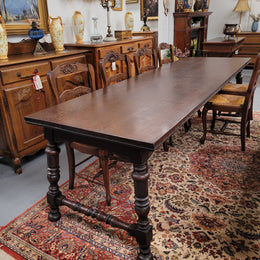 An Australian Silky Oak Spanish style refectory dining table measuring 274.5 cm in length. It can comfortable sit 8-10 people and is a very hard to find size. It is in good original detailed condition.