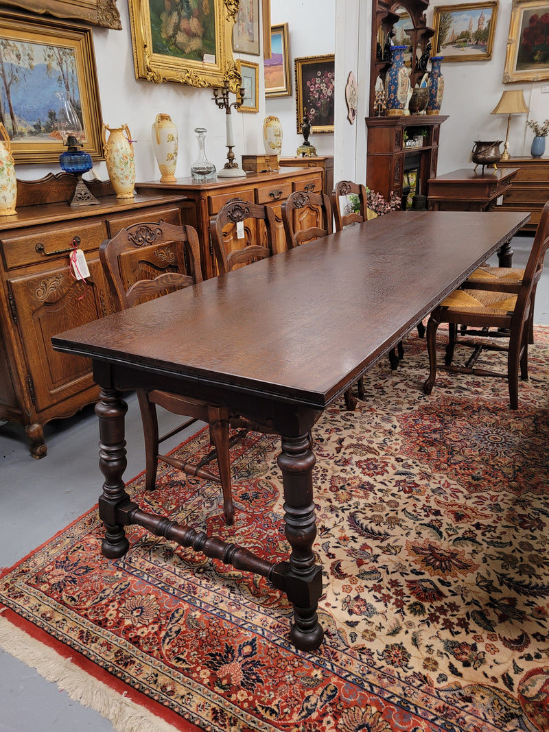 An Australian Silky Oak Spanish style refectory dining table measuring 274.5 cm in length. It can comfortable sit 8-10 people and is a very hard to find size. It is in good original detailed condition.