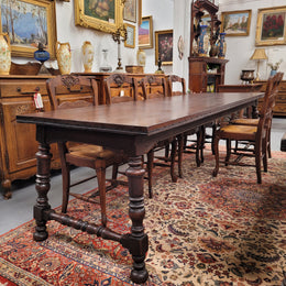 An Australian Silky Oak Spanish style refectory dining table measuring 274.5 cm in length. It can comfortable sit 8-10 people and is a very hard to find size. It is in good original detailed condition.