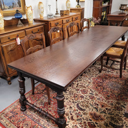 An Australian Silky Oak Spanish style refectory dining table measuring 274.5 cm in length. It can comfortable sit 8-10 people and is a very hard to find size. It is in good original detailed condition.