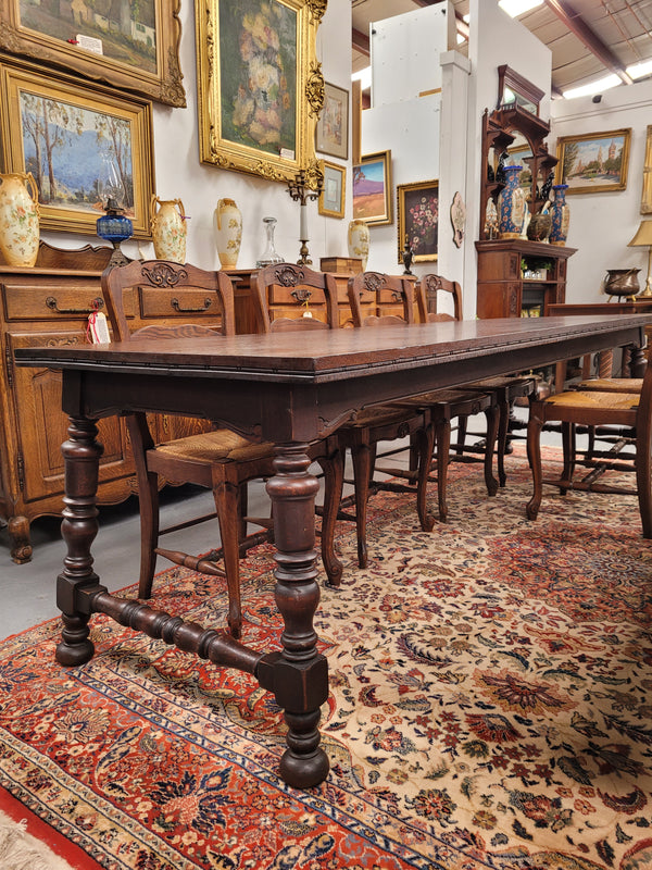 An Australian Silky Oak Spanish style refectory dining table measuring 274.5 cm in length. It can comfortable sit 8-10 people and is a very hard to find size. It is in good original detailed condition.