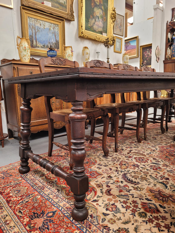 An Australian Silky Oak Spanish style refectory dining table measuring 274.5 cm in length. It can comfortable sit 8-10 people and is a very hard to find size. It is in good original detailed condition.