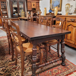 An Australian Silky Oak Spanish style refectory dining table measuring 274.5 cm in length. It can comfortable sit 8-10 people and is a very hard to find size. It is in good original detailed condition.