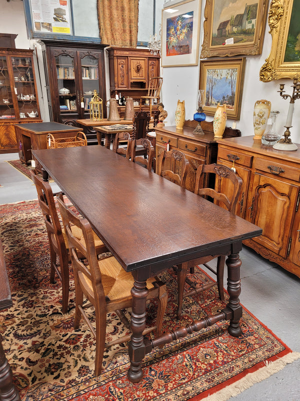 An Australian Silky Oak Spanish style refectory dining table measuring 274.5 cm in length. It can comfortable sit 8-10 people and is a very hard to find size. It is in good original detailed condition.