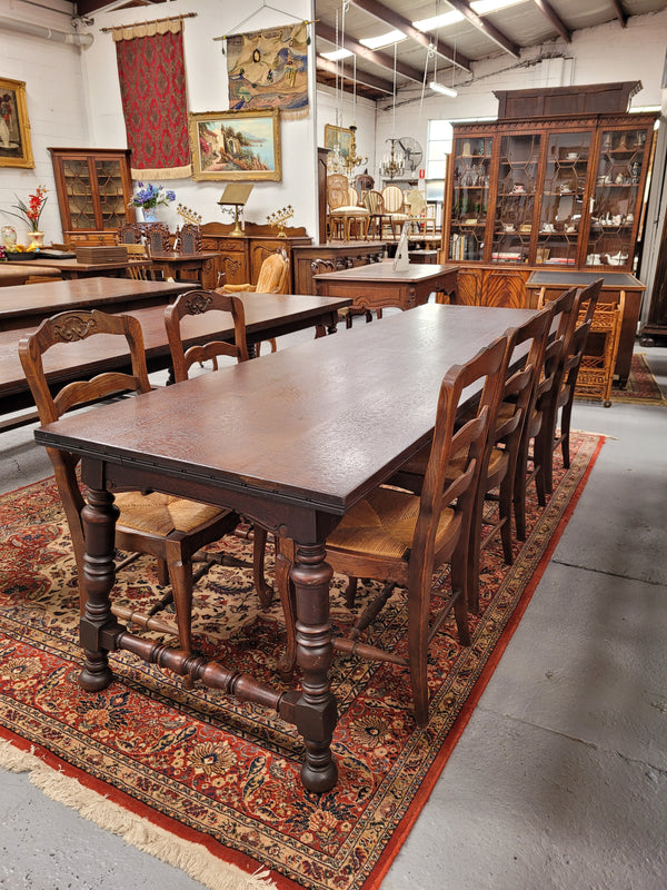 An Australian Silky Oak Spanish style refectory dining table measuring 274.5 cm in length. It can comfortable sit 8-10 people and is a very hard to find size. It is in good original detailed condition.
