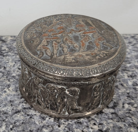Unusual Antique silver over pottery Italian trinket box nicely decorated with Cherubs. It is in good original condition, please view photos as they help form part of the description.