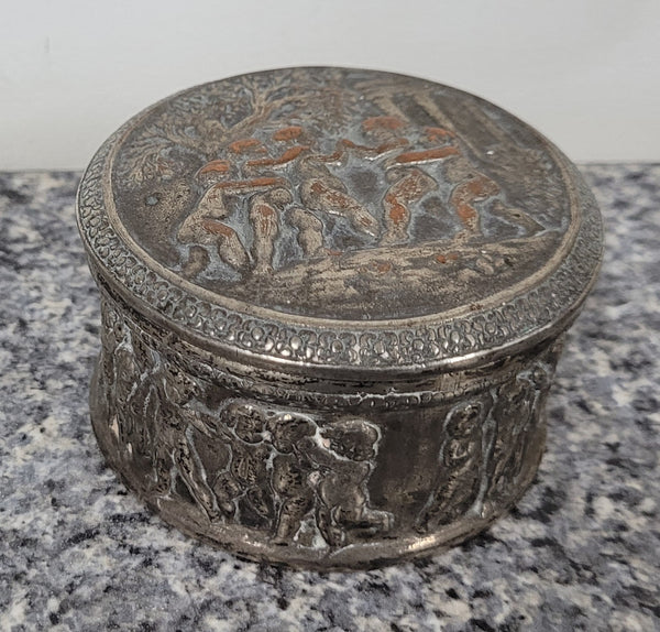 Unusual Antique silver over pottery Italian trinket box nicely decorated with Cherubs. It is in good original condition, please view photos as they help form part of the description.