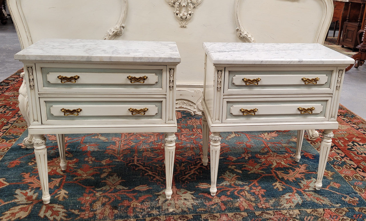Attractive pair of Vintage French Louis 16th style two drawer marble topped bedsides. They have been sourced from France and are in good original condition.