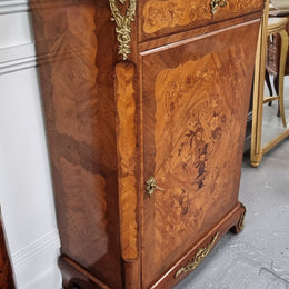 Elegant French transitional style Walnut & Kingwood Salon cabinet. It has beautiful marquetry inlay, a marble top and decorative ormolu mounts. Sourced From France and is in good original detailed condition.