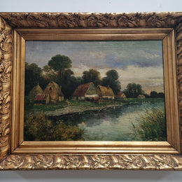 Lovely framed original oil on canvas of a country cottage scene on a river in good original condition