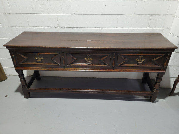 Early 19th Century Oak three drawer dresser Base in good original detailed condition commensurate with age.