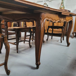 French Oak Louis XV style parquetry top extension table. It can sit six people when not extended and eight when fully extended. It has been sourced from France and is in original detailed condition.