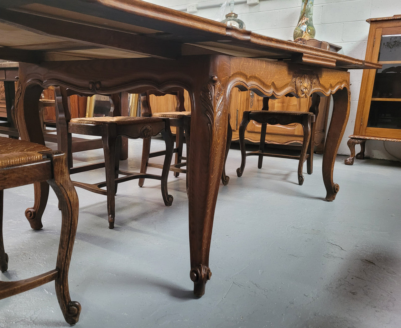 French Oak Louis XV style parquetry top extension table. It can sit six people when not extended and eight when fully extended. It has been sourced from France and is in original detailed condition.