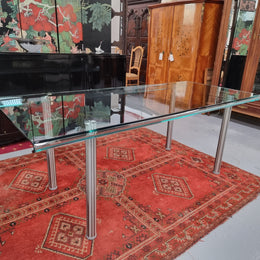 Striking and distinctive Vintage FIAM Italia Designer curved edge glass desk. FIAM was founded in 1973 by Vittorio Livio and has become synonymous with glass culture in Italy and the World. FIAM is still manufacturing today, in collaboration with various Designers, and has won numerous awards and is represented in various international museums. 

Condition: Evidence of use with minor scratches to the surface and a small chip that has been repaired. Overall, in very good condition with one repaired chip to t