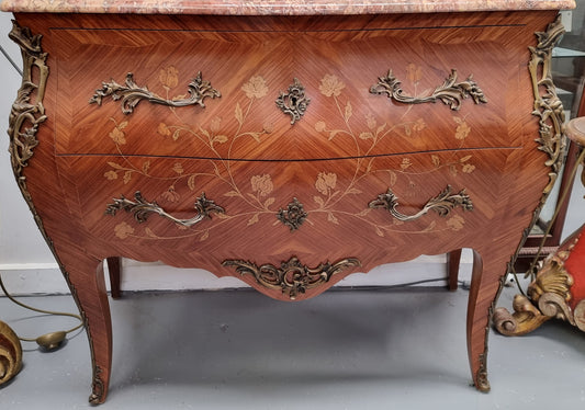 Stunning Louis XV style marquetry inlay marble top two drawer commode. It has decorative ormolu mounts and beautiful marble top. In good original detailed condition.