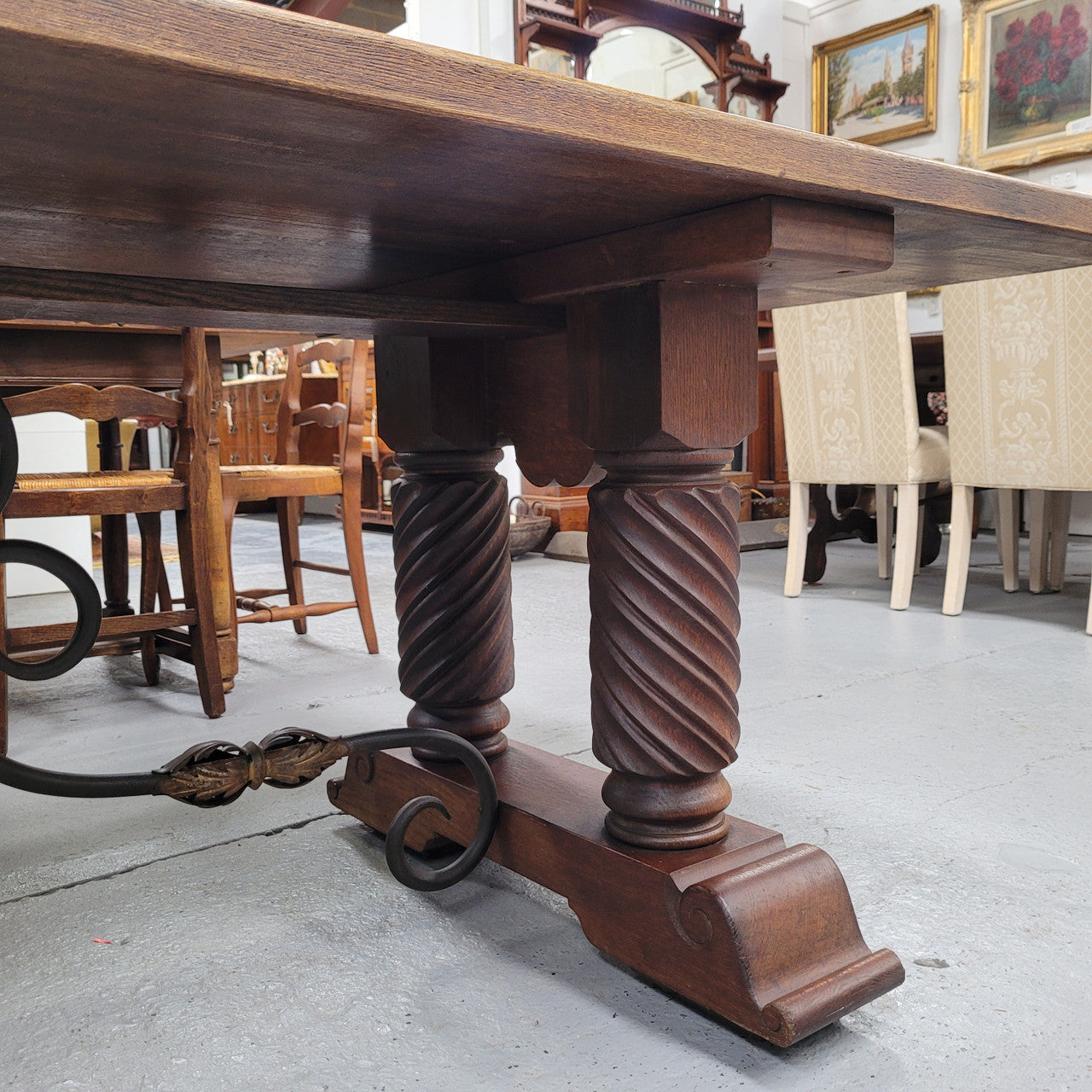 Amazing French Oak Spanish Renaissance style dining table with beautiful decorative iron work. It has been sourced from France and can comfortable seat 8- 10 people. Sourced from France and is good original detailed condition.