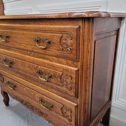 French Louis XV style Oak three drawer chest with wooden top. It has been sourced from France and is in good original detailed condition.