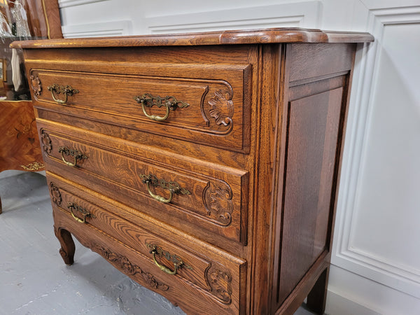 French Louis XV style Oak three drawer chest with wooden top. It has been sourced from France and is in good original detailed condition.