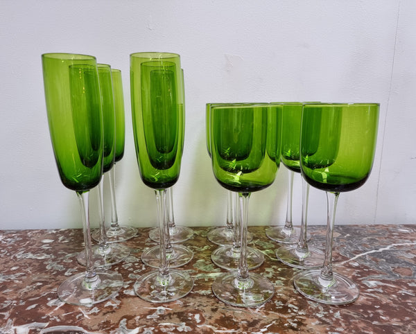 Beautiful set of 12 Vintage emerald green hand made wine glasses. Possibly Italian or French. They are in good original condition with no chips or cracks.
