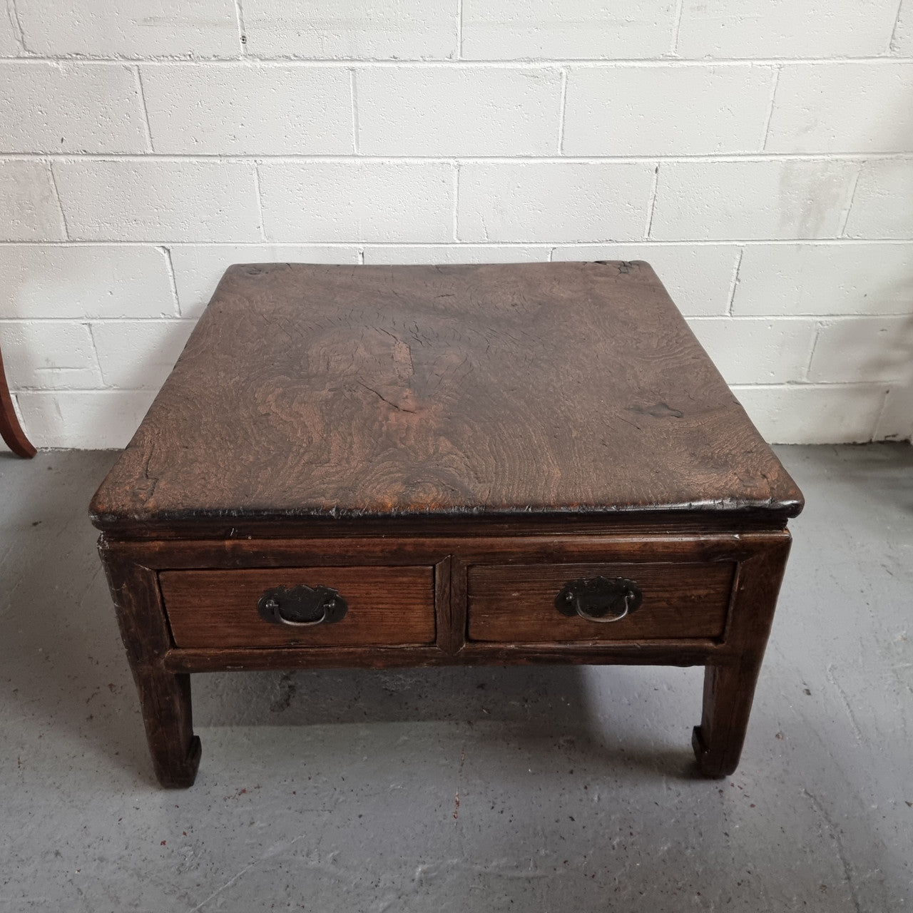 Square Elm coffee table with oriental legs and two long drawers.  Beautifully finished and in good original condition. It has been sourced from France.