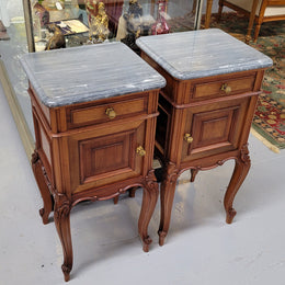 Pair of Walnut Louis XV style grey marble top bedside cabinets. Single drawer, one cupboard and lovely French cabriole legs. They have been sourced from France and are in good original condition.